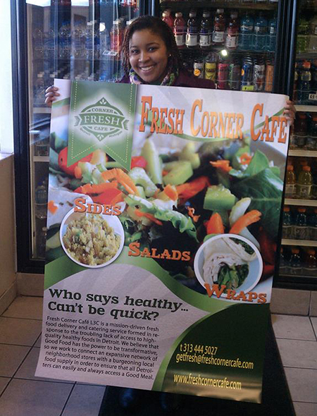 Val Waller, Fresh Corner Cafe co-owner, displays some of the attractive signage that helps a store market fresh food items.